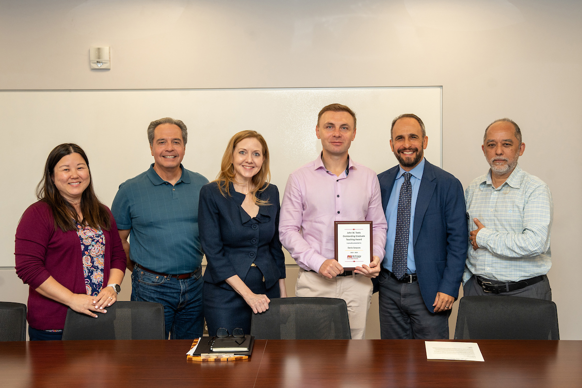 Denis Sosyura is presented with a John W. Teets Outstanding Teaching Award