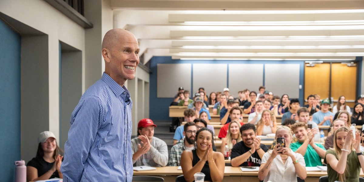 Chris Neck is surprised with a Teets Award during one of his lectures.