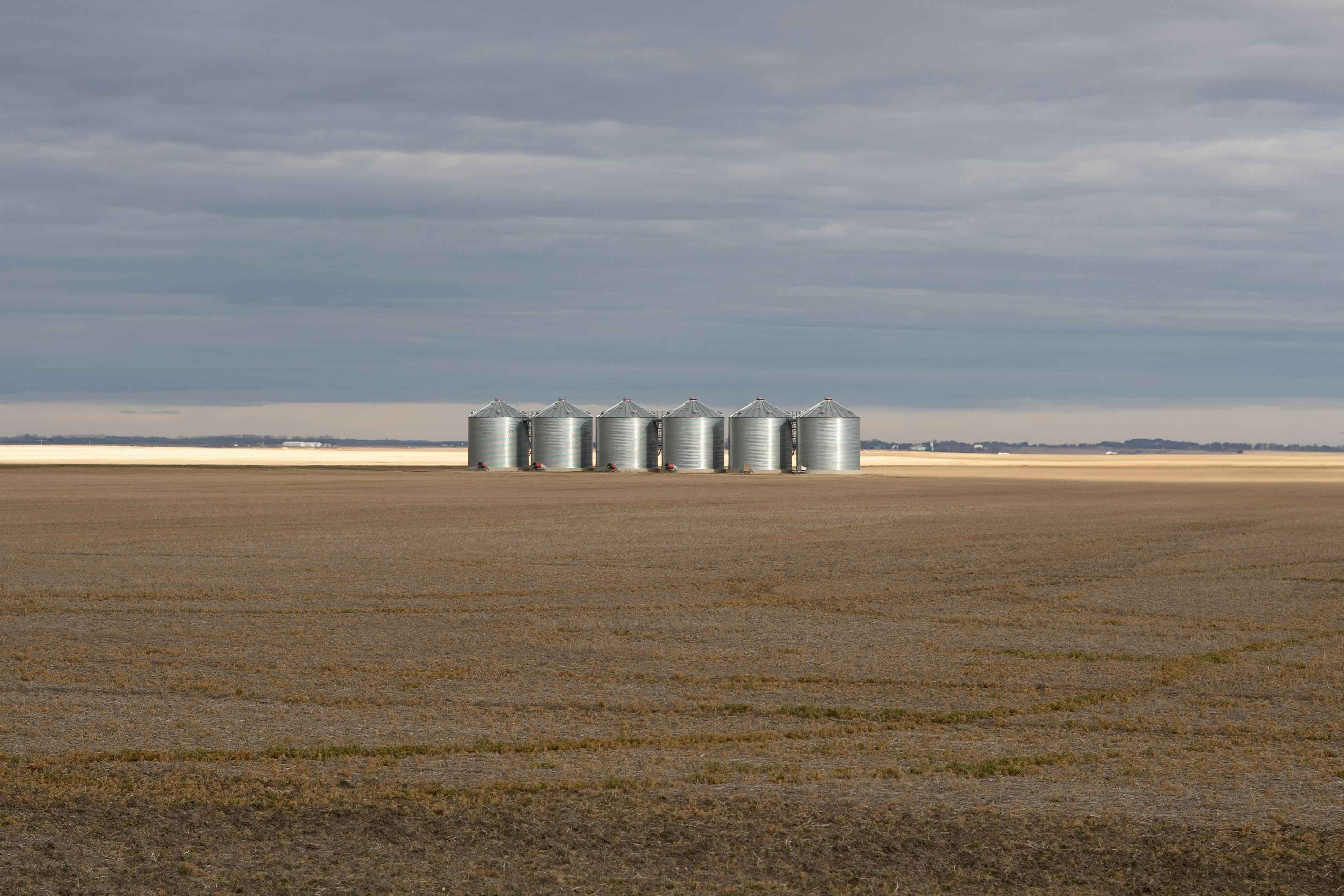 Six silos in the distance.