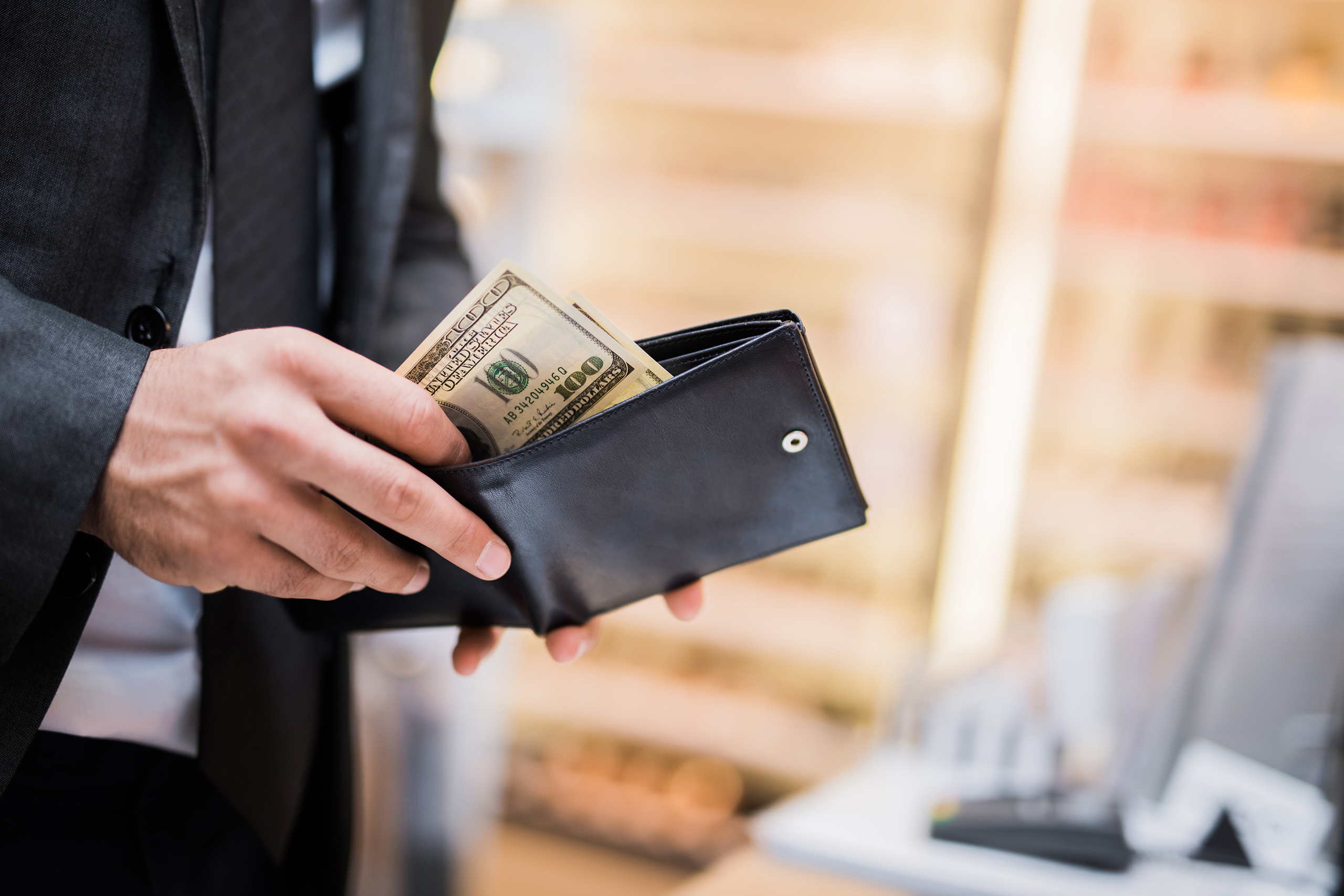 Man with Money in Wallet.jpg
